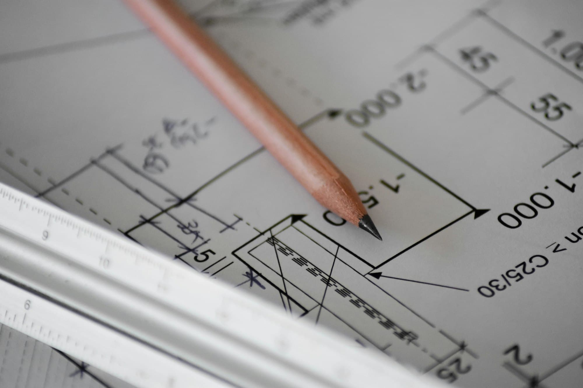 Pencil on a dimensioned construction drawing