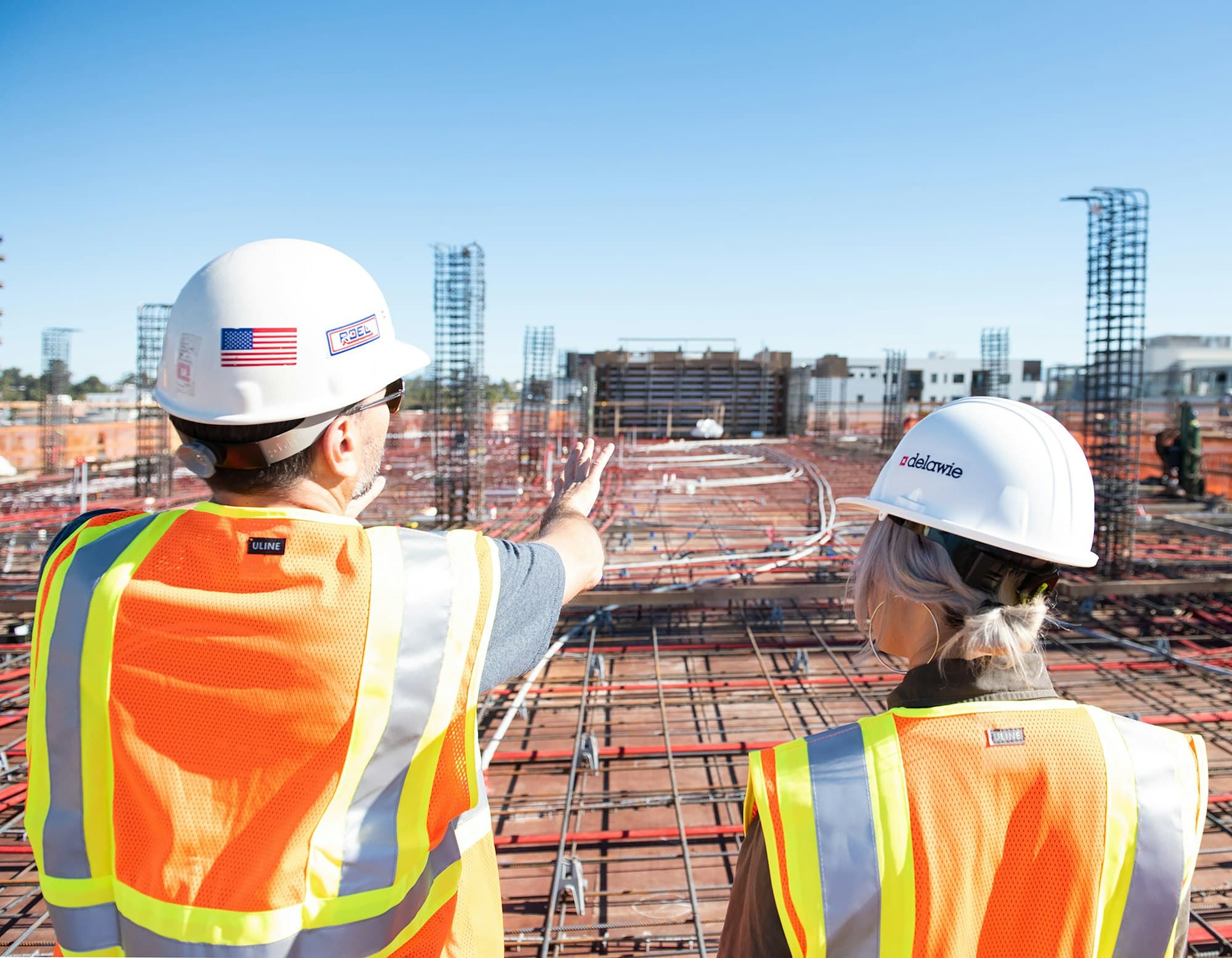 Site management team in hard hats on a construction site