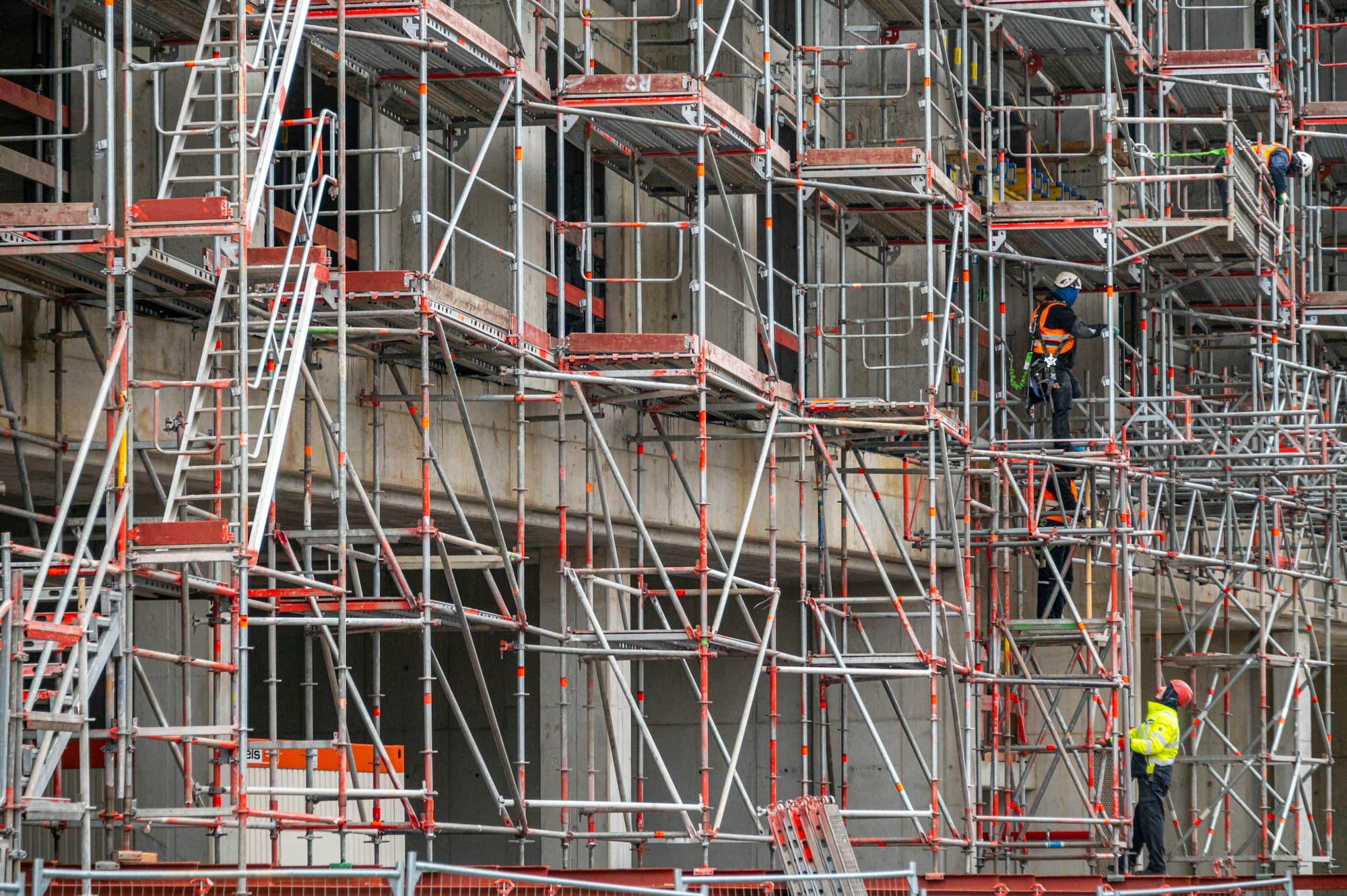 Workers on facade scaffolding