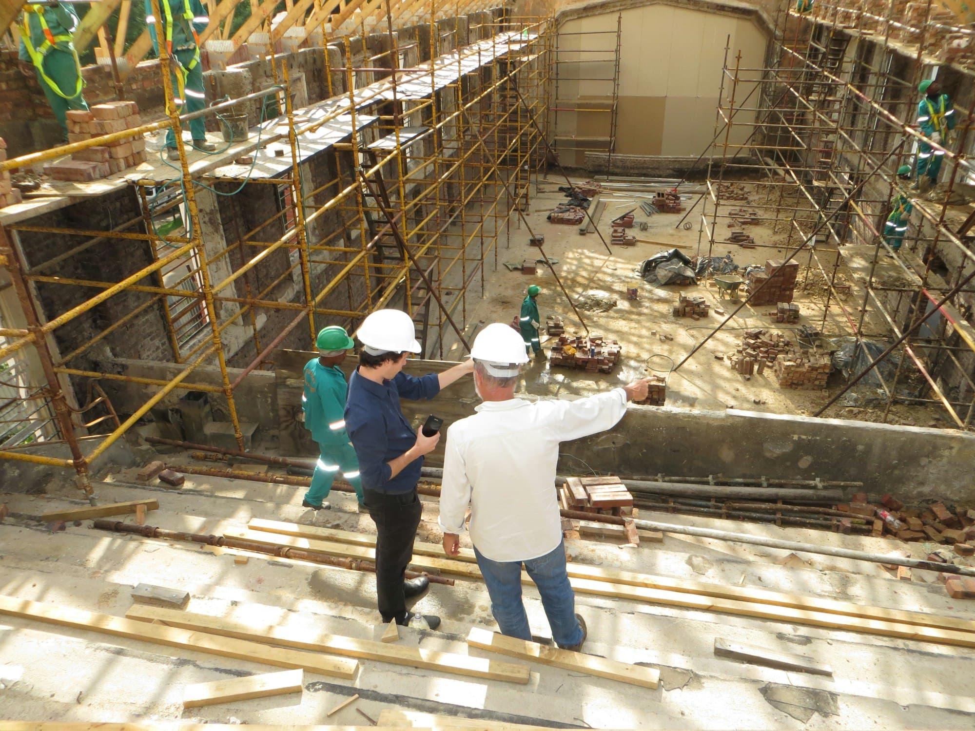 Site management discussing construction progress on site