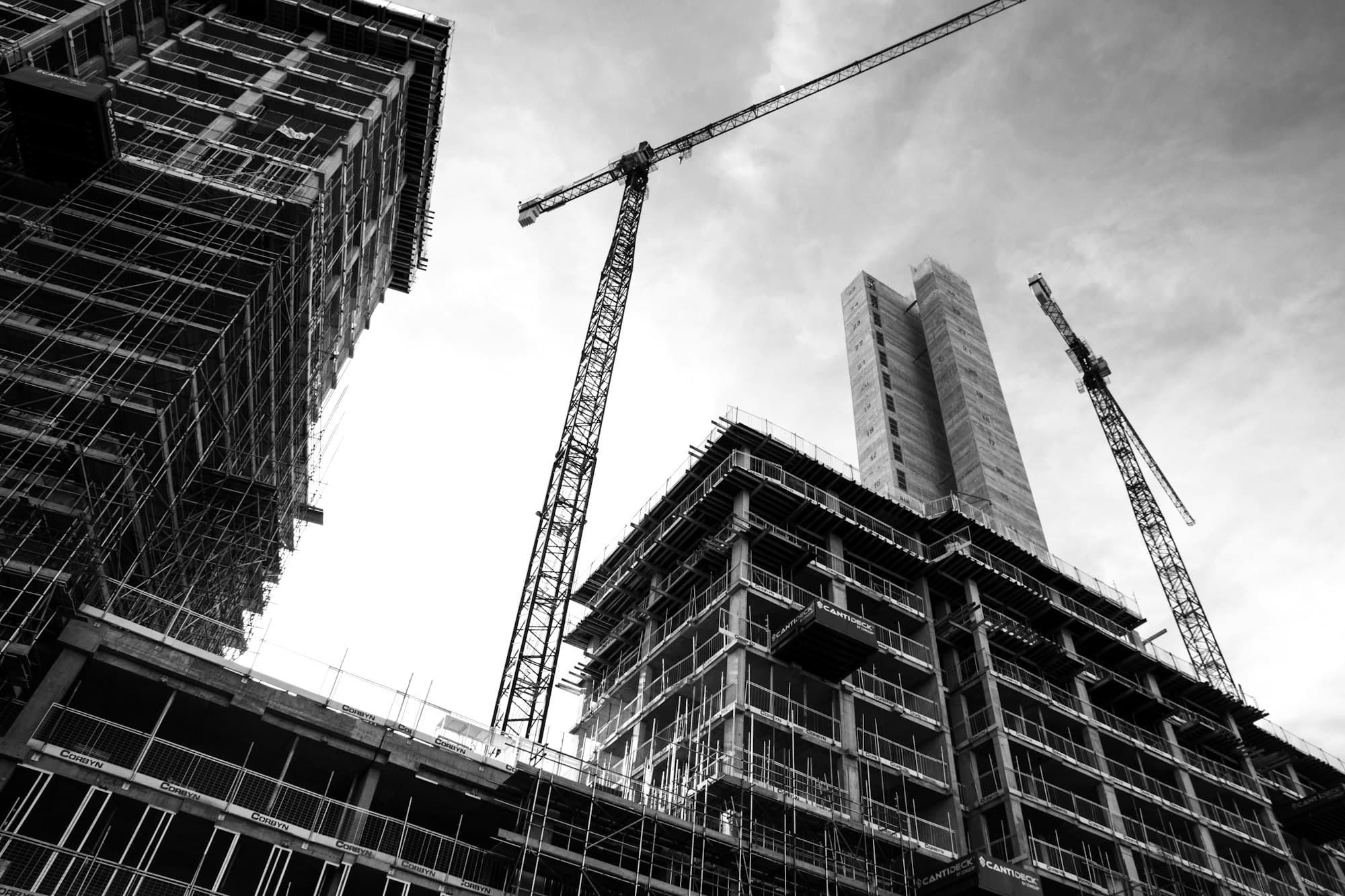 Tower cranes above a building under shell construction